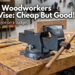 Simple woodworkers bench vise attached to wooden workbench in home workshop